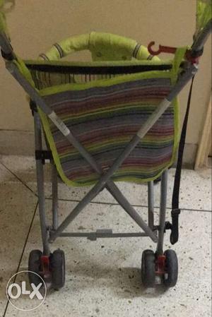 Baby's Green And Gray Stroller