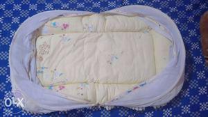 Baby's White And Blue Mosquito Net Bed