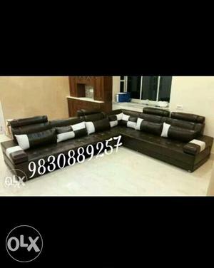 Black And White Tufted Leather Sectional Sofa With Pillows