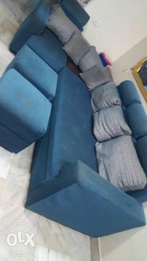 Blue Suede Sectional Sofa With Ottoman And Throw Pillow
