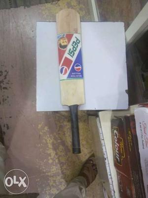 Brown And Black Wooden Pepsi Paddle