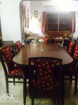 Brown Wooden Table With Fabric Padded Chairs Dining Set
