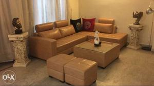 Corner sofaset with centre table n two puffies,