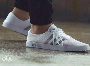 Pair Of White Adidas Low Top Sneakers
