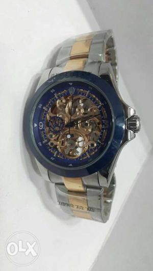 Round Blue, Silver, And Gold Skeleton Watch