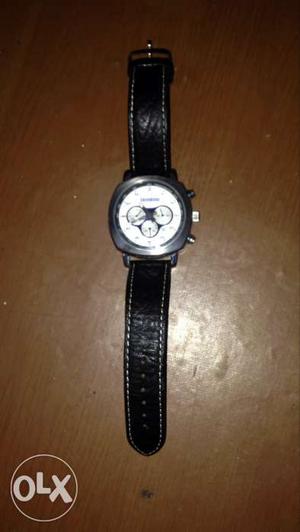 Round Silver Chronograph Watch With Black Strap