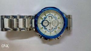 Round White And Blue Chronograph Watch With Link Bracelet