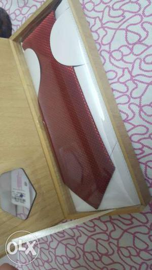 Silk red tie packed in original box. ideal for
