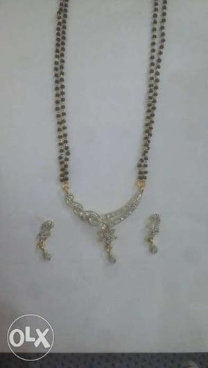 Silver And Gold Pendant Necklace And Earrings