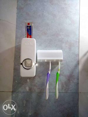 Toothpaste brush stand