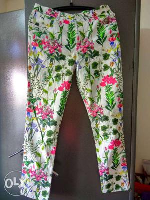 White, Green, And Pink Floral Fabric Pants