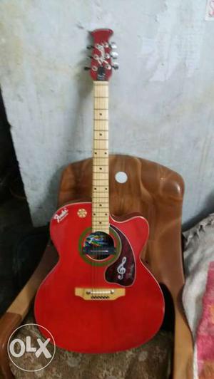 Brand new Acoustic Guitar with tomato red colour.