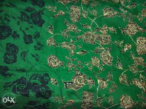 Green, Black, And Beige Floral Textile