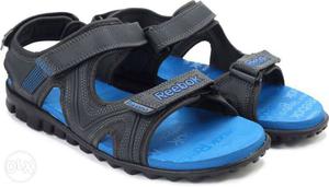 Pair Of Black-and-blue Reebok Sandals
