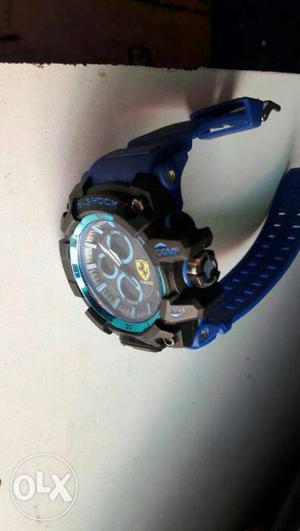 Round Black Chronograph Watch With Blue Strap