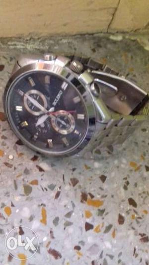 Round Black Face Chronograph Watch With Silver Link Bracelet