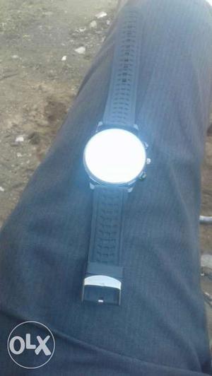 Round Silver Watch With Black Rubber Strap