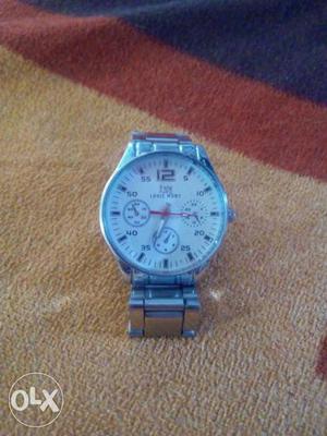 Round White And Silver Chronograph Watch