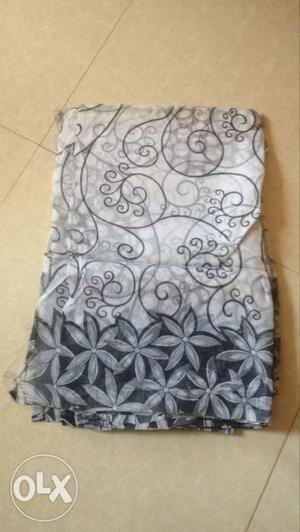 White And Gray Floral Textile