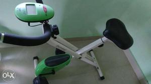 White, Green, And Black Stationary Bicycle