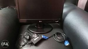 Black Lg Flat Screen Computer Monitor And Blue Avg Cable