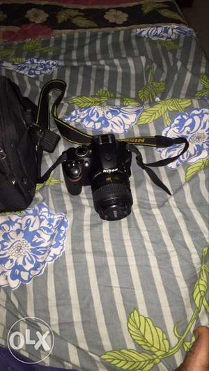 Black Nikon D Digital Camera With Bag
