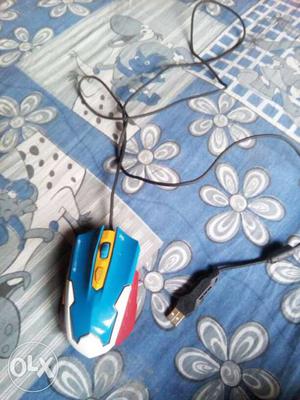 Blue, White And Red Corded Computer Mouse