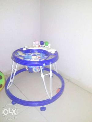 Baby's Blue And White Exersaucer