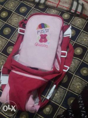 Baby's Pink And Red Carrier