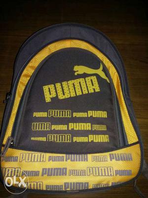 New Unused Gray And Yellow Puma Backpack
