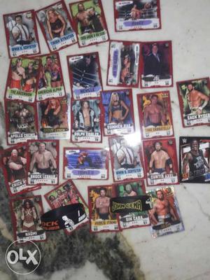 WWE Collectible Player Cards and two wwe bands of rock and