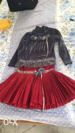 Women's Black Sweater; Red Skirt