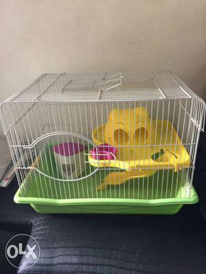 Less used hamster cage along with wheeler food
