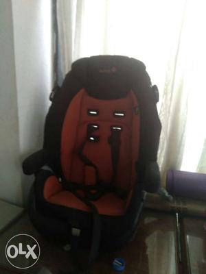 Baby's Orange And Black Booster Seat