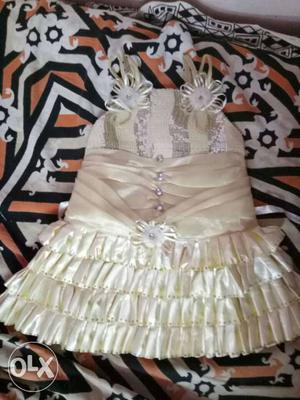 Cream satin party frock for upto2yrs baby