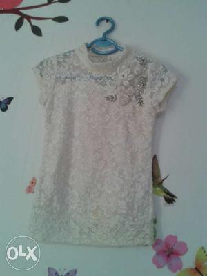 Cute and beautiful off white top.Hardly