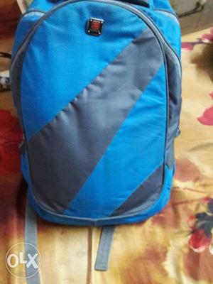 It Is A Blue Colour Desgined Bag. It Has 3