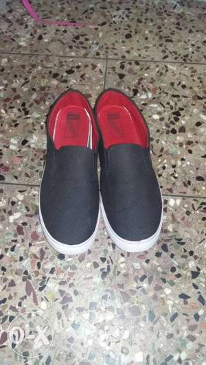 Pair Of Black Slip-on Shoes