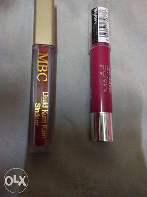 Red Sindoor and pink colour glosy lipstick.