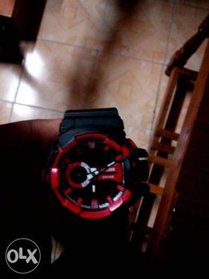 Round Black And Red-faced Digital Watch With Black Straps