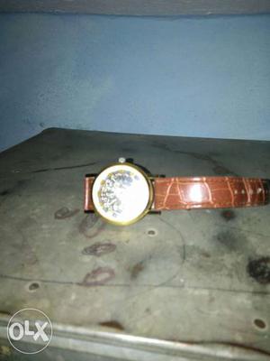 Round Gold Watch With Brown Leather Strap
