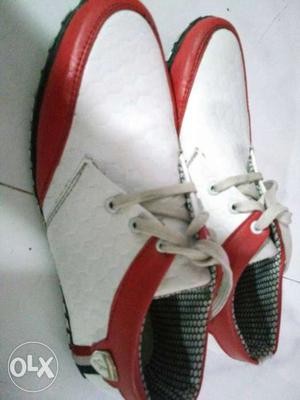Size 7 red and white casual shoes.