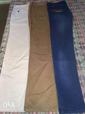 Three Blue, Brown, And White Pants