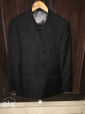 Van Heusen - Black suit with stripes. size 42