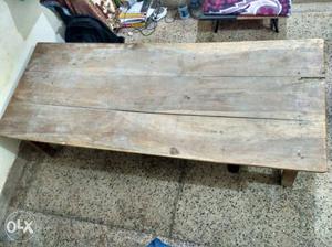 A brown rectangular wooden bed. In good condition