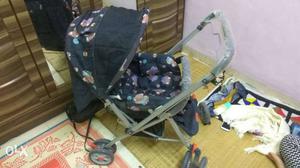 Baby's Grey And Blue Floral Stroller only one time used