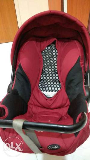 Baby's Red And Black Convertible Car Seat