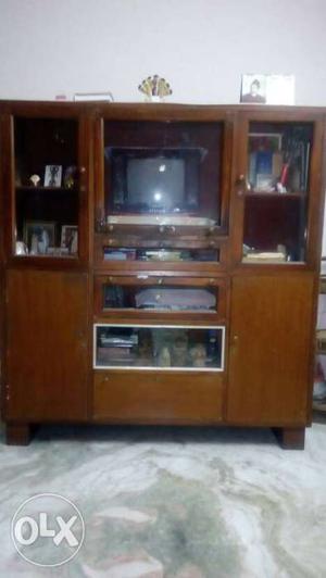 Black CRT Television; Brown Wooden Television Hutch