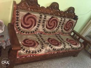 Brown Wooden Framed Silver And Red Cushion Couch