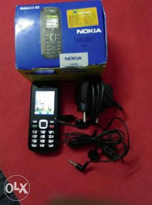 Nokia c1_02 with chrger, head phones, orignle box